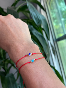 Red string adjustable protection bracelet
